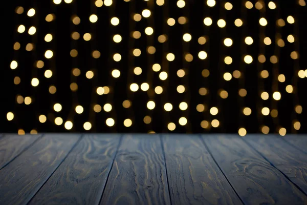Empty wooden surface and beautiful golden bokeh background — Stock Photo