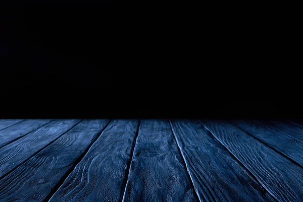 Empty dark blue wooden planks surface on black background — Stock Photo