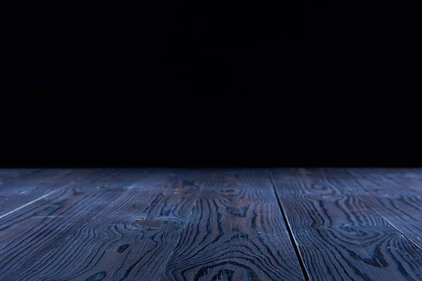 Empty blue wooden planks surface on black background — Stock Photo