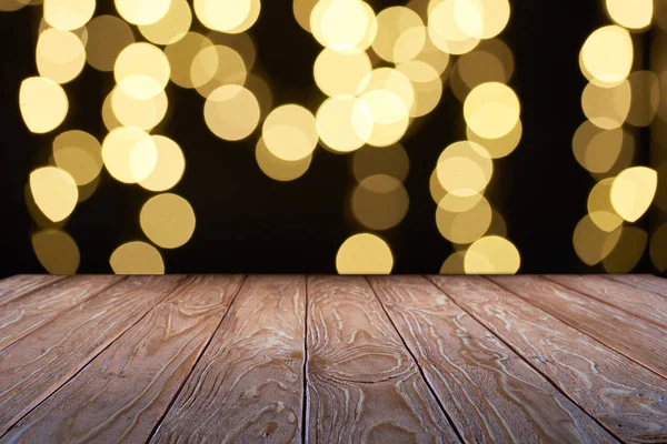 Empty wooden surface and beautiful yellow bokeh background — Stock Photo