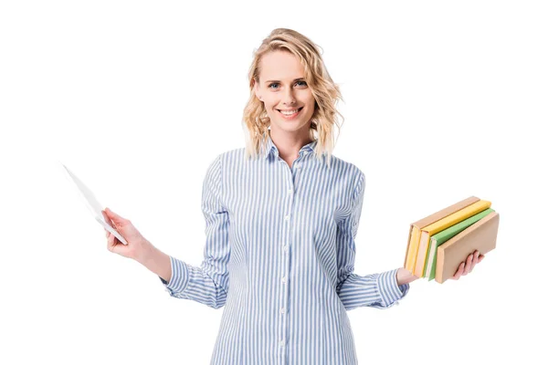 Attractive woman holding tablet and books and looking at camera isolated on white — Stock Photo