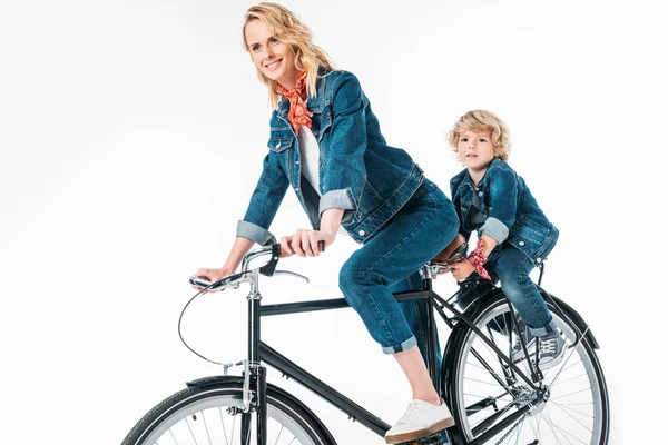 Mother and son riding bicycle isolated on white — Stock Photo