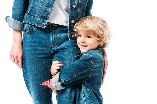 Cropped image of son hugging mothers leg isolated on white — Stock Photo