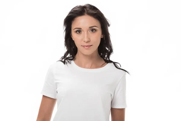 Portrait of pensive young woman in white shirt looking at camera isolated on white — Stock Photo