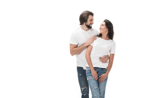 Portrait of smiling couple looking at each other isolated on white — Stock Photo