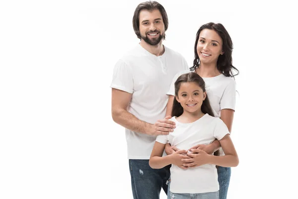 Retrato de família feliz em camisas brancas e jeans isolados em branco — Fotografia de Stock