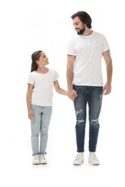 Happy father and daughter holding hands and looking at each other isolated on white — Stock Photo