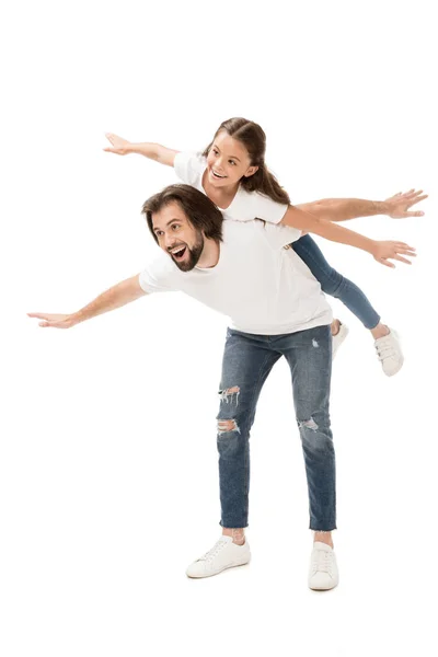 Cheerful father and little daughter in white shirts piggybacking isolated on white — Stock Photo