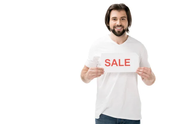 Hombre barbudo sonriente con banner de venta en manos aisladas en blanco - foto de stock