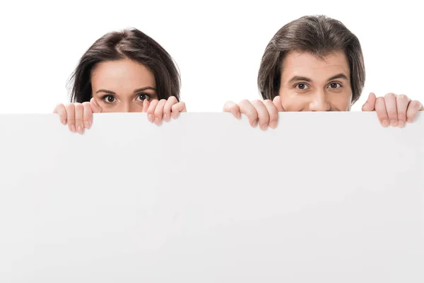 Obscured view of couple with blank banner isolated on white — Stock Photo