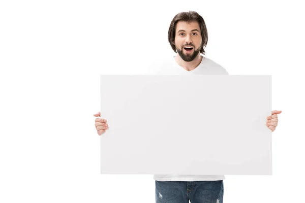 Portrait of shocked bearded man with blank banner in hands isolated on white — Stock Photo