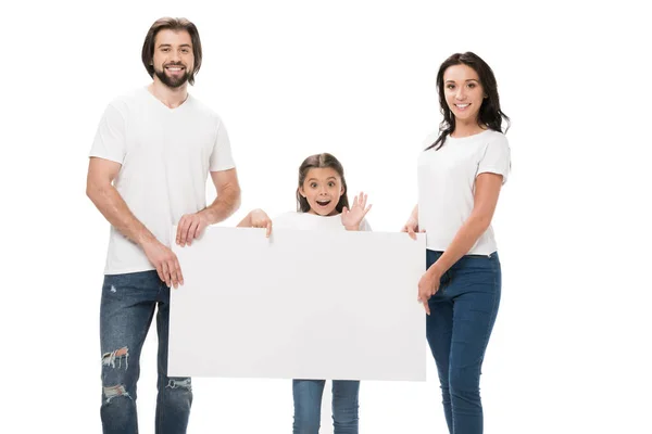 Pais sorridentes e filha animada com banner em branco isolado no branco — Fotografia de Stock