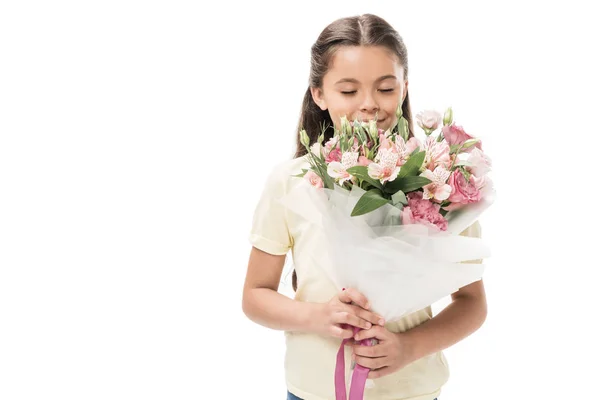 Portrait of kid with eyes closed and bouquet of flowers isolated on white — Stock Photo
