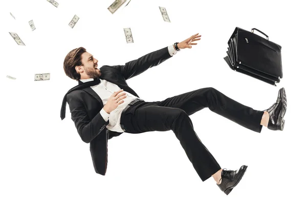 Gritando jovem empresário caindo com dinheiro e pasta isolada em branco — Fotografia de Stock