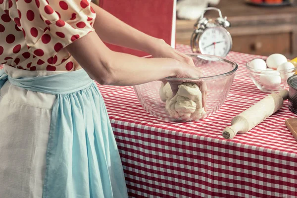 Cropped shot of housewife preparing dough in glass bowl at kitchen — Stock Photo