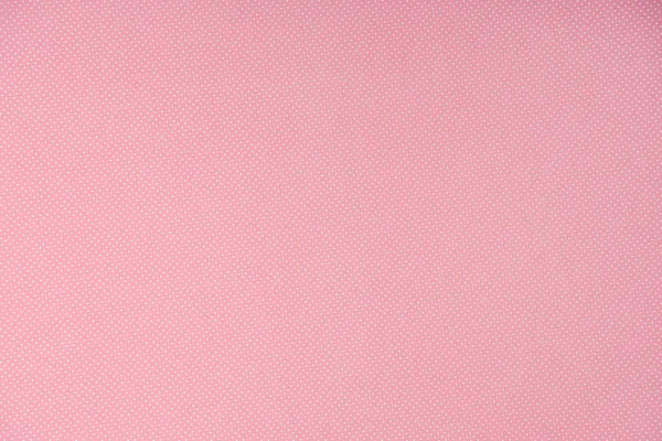 Vista superior de lunares blancos sobre fondo rosa - foto de stock