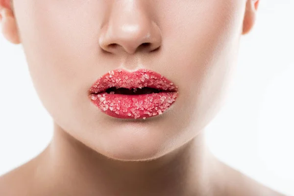 Vista parcial de chica con azúcar dulce en los labios, aislado en blanco - foto de stock