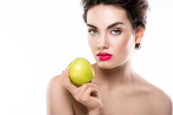 Attractive girl holding green organic apple, isolated on white — Stock Photo