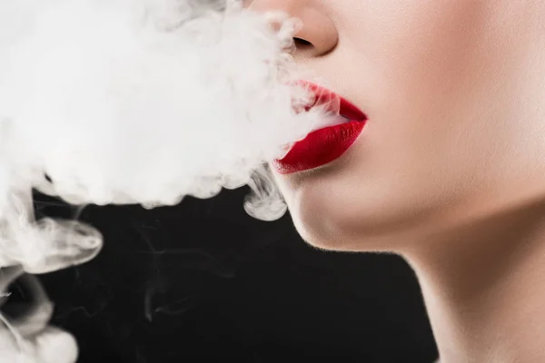 Cropped view of smoking woman blowing smoke, isolated on grey — Stock Photo