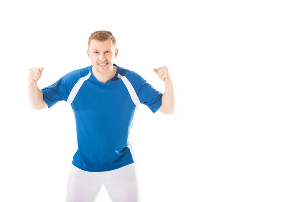 Emotional young soccer player shaking fists and looking at camera isolated on white — Stock Photo