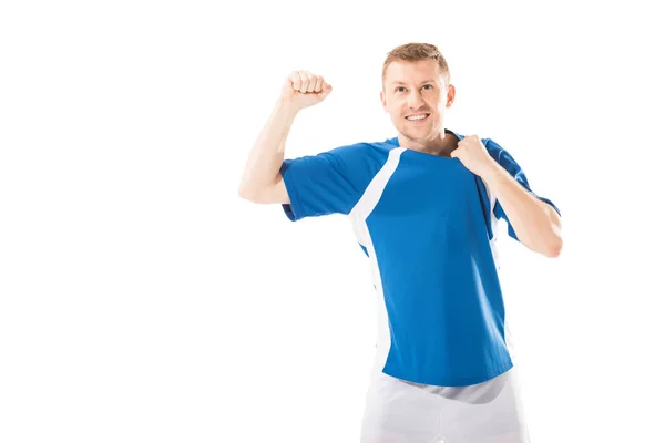 Triunfante jovem desportista balançando punho e sorrindo isolado no branco — Fotografia de Stock