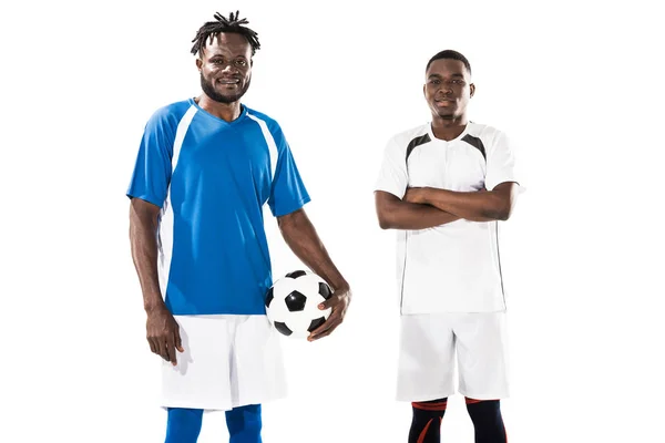 Athletic young african american soccer players smiling at camera isolated on white — Stock Photo