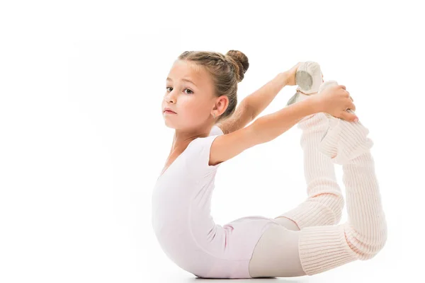 Linda criança fazendo exercícios de ginástica isolada no fundo branco — Fotografia de Stock