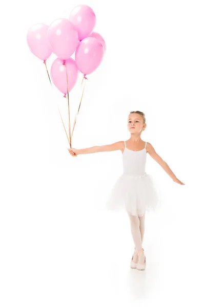 Little ballerina in tutu dancing with pink balloons isolated on white background — Stock Photo