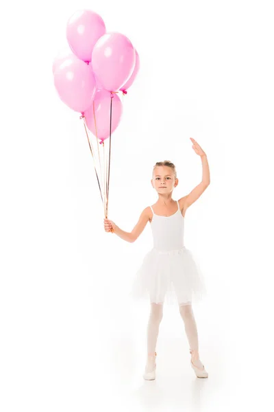 Bela pequena bailarina em tutu dançando com balões rosa isolado no fundo branco — Fotografia de Stock