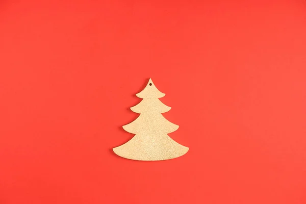 Close-up view of decorative fir tree symbol on red background — Stock Photo