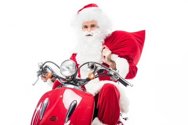 Babbo Natale in costume tenendo sacco di Natale e cavalcando su scooter isolato su sfondo bianco — Foto stock