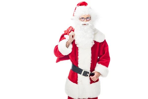 Happy santa claus in eyeglasses holding christmas sack over shoulder isolated on white background — Stock Photo