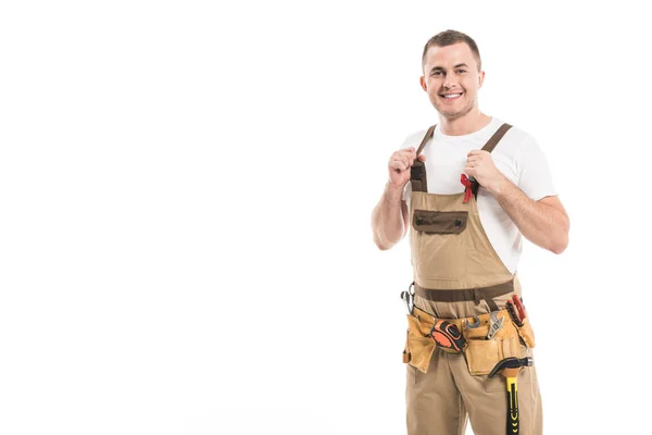 Schöner erwachsener Bauunternehmer mit Hilfsmitteln Bewusstsein rote Schleife auf Gesamt Blick auf Kamera isoliert auf weiß — Stockfoto