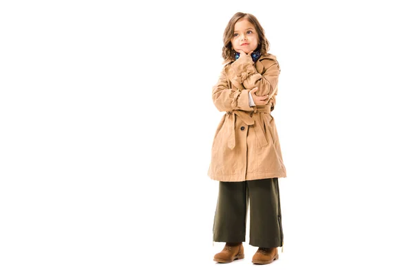 Thoughtful adorable child in trench coat isolated on white — Stock Photo