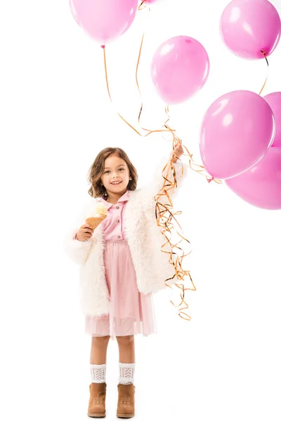 Stylish happy child with pink air balloons and ice cream isolated on white — Stock Photo