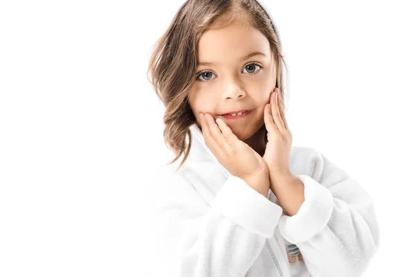 Little child in white bathrobe looking at camera isolated on white — Stock Photo