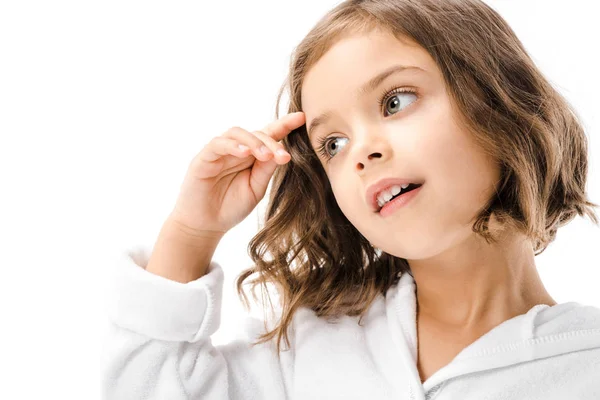 Portrait of adorable child in white bathrobe looking away isolated on white — Stock Photo