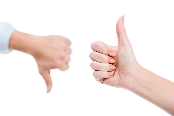 Selective focus of woman and man showing thumb up and thumb down isolated on white — Stock Photo