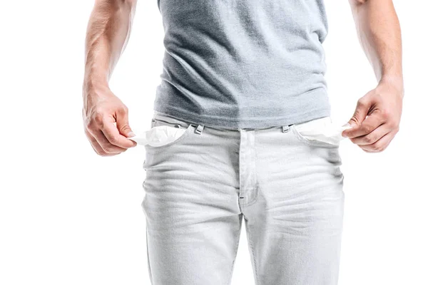 Cropped image of man showing empty pockets isolated on white — Stock Photo