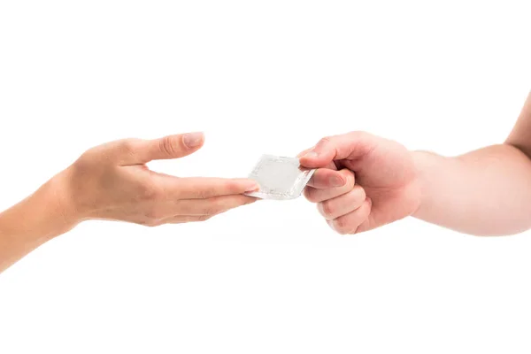 Cropped image of girlfriend giving condom to boyfriend isolated on white, world aids day concept — Stock Photo