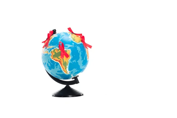 Globe with red ribbons isolated on white, world aids day concept — Stock Photo
