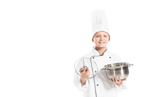 Portrait of smiling boy in chef uniform with saucepan isolated on white — Stock Photo