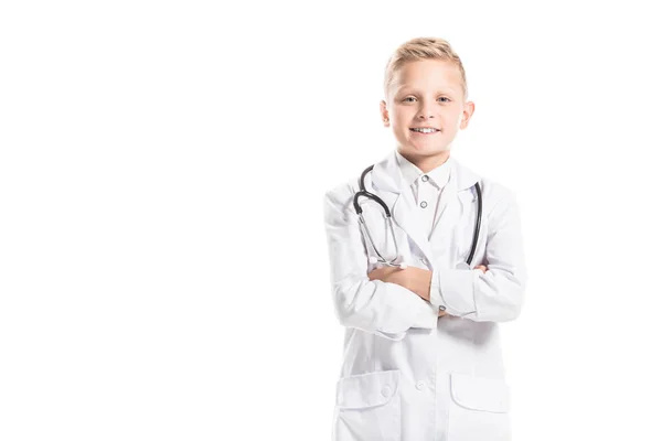 Portrait of smiling preteen boy in doctors white coat with stethoscope isolated on white — Stock Photo