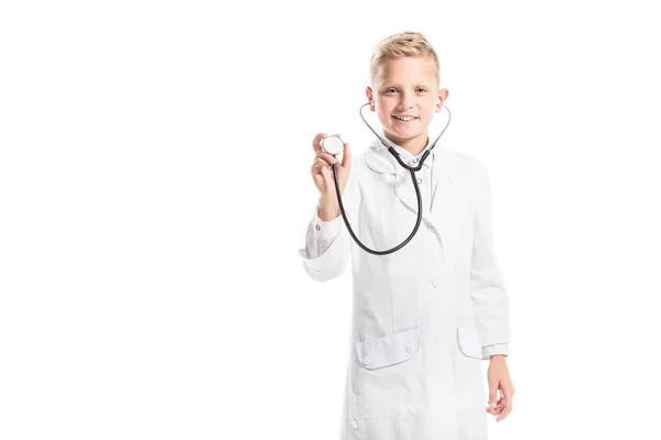Portrait of smiling preteen boy in doctors white coat with stethoscope isolated on white — Stock Photo
