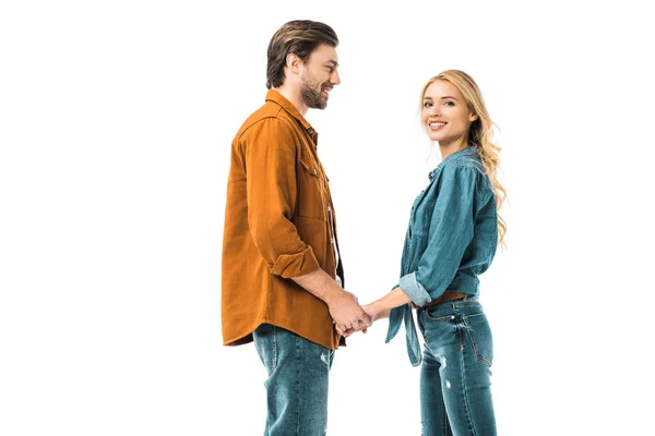 Young cheerful couple holding hands of each other isolated on white — Stock Photo