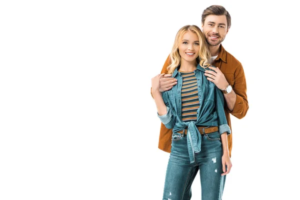 Handsome man embracing girlfriend from behind isolated on white — Stock Photo