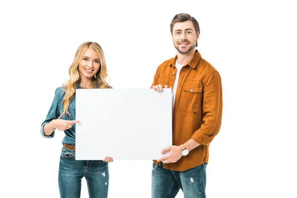 Beautiful woman pointing by finger at empty banner while her boyfriend standing near isolated on white — Stock Photo