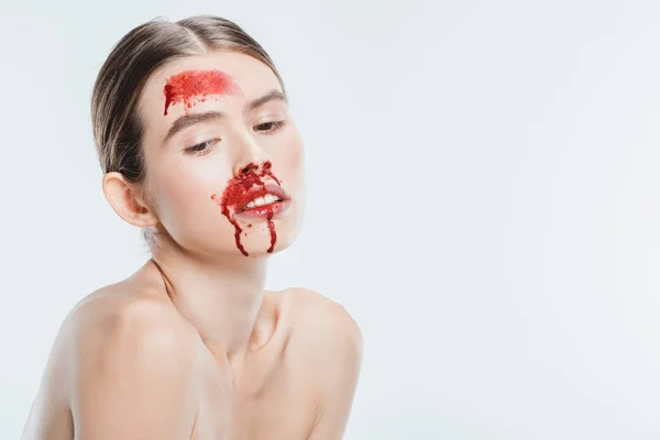 Female victim of domestic violence with blood on face isolated on white — Stock Photo