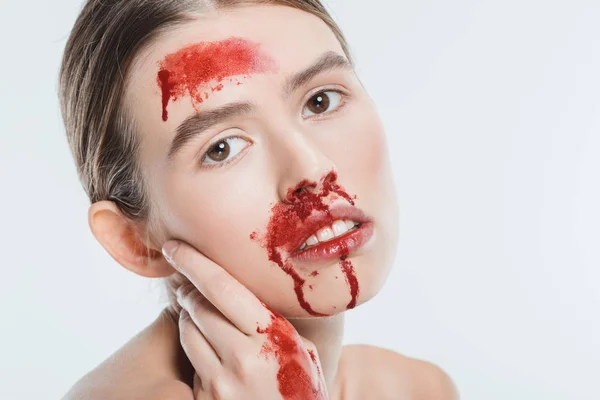 Close up of nude female domestic violence victim with red blood isolated on white — Stock Photo