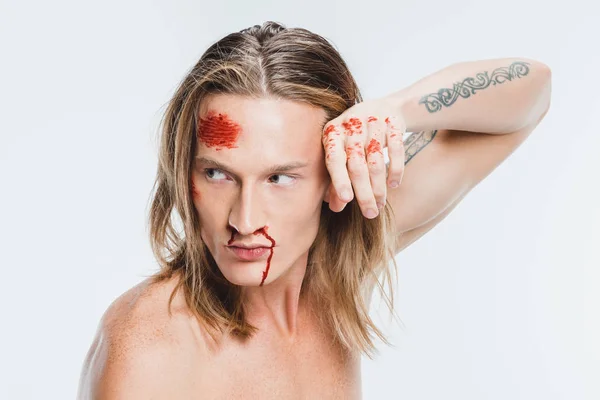 Close up of adult man with bloody bruises on face isolated on white — Stock Photo